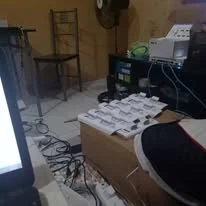 Access points lined up on a table to be configured before installation