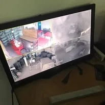 A monitor showing four of the school's CCTV camera views