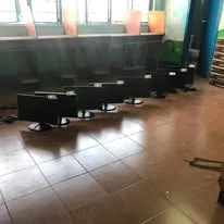 A row of new monitors lined up on the computer room floor