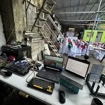 Laptops, a keyboard and streaming gear on the event's tech table
